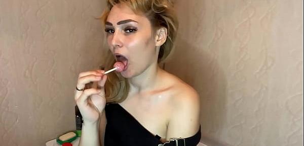  Charming Lady in Sexy Lingerie Licking Lollipop